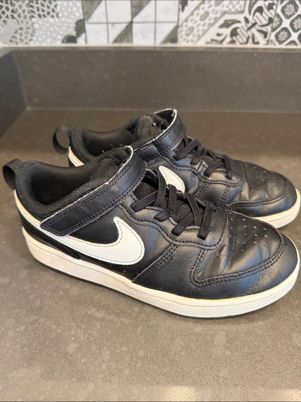 Nike Kids Black Sneakers with White Swoosh